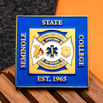 Square gold and blue lapel pin for Seminole State College Center for Public Safety featuring a Star of Life and maltese cross.