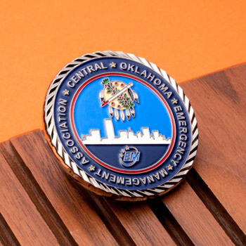 Central Oklahoma Emergency Management Association challenge coin with a blue skyline design and rope edge detailing.