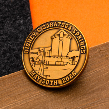 Antique gold challenge coin featuring Disney's Saratoga Springs resort architecture and the date May 30th, 2026.