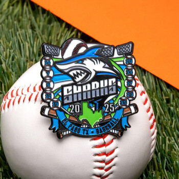 Custom baseball lapel pin featuring a shark mascot, Texas map, stadium lights, and team numbers resting on a baseball.