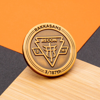 Antique bronze challenge coin for Rakkasans 3/187th Recon featuring a Torii gate emblem inside a triangle.