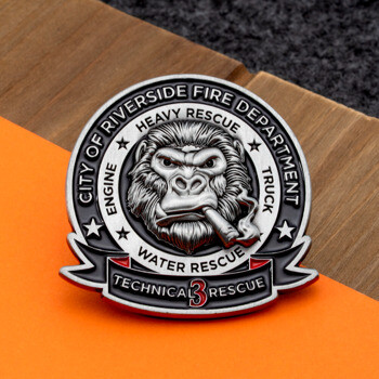 Enamel lapel pin for City of Riverside Fire Department featuring a gorilla smoking a cigar with technical rescue text.