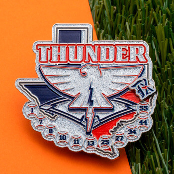 Custom Texas shaped lapel pin featuring the word Thunder, a glittery eagle with a lightning bolt, and baseball player numbers.