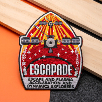 Embroidered ESCAPADE mission patch featuring satellites, sun rays, and a planetary horizon.