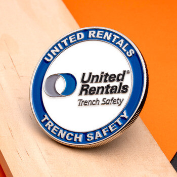 United Rentals Trench Safety custom challenge coin with blue and white enamel and reeded edge