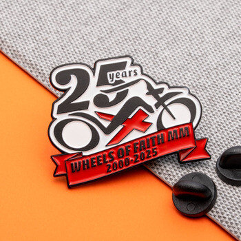 Wheels of Faith MM 25th anniversary motorcycle lapel pin with red banner and black rubber clutches